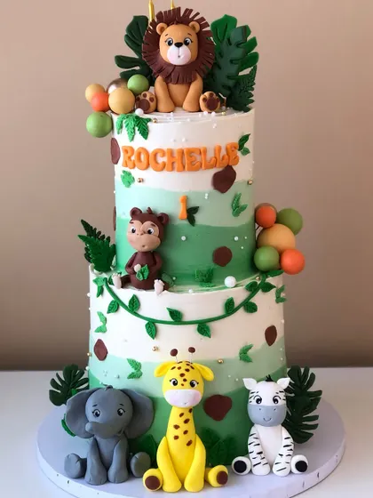 Another shot of the full safari cake, showing the beautiful green ombre buttercream and animal details.