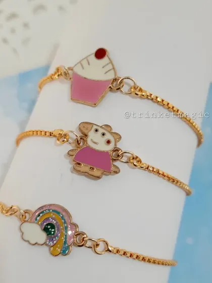 Perfect for little ones, these adjustable charm bracelets are all about fun. This set includes adorable Peppa Pig, cupcake, and rainbow enamel charms on a delicate gold-tone chain, making them great for party favors or festive gifts.