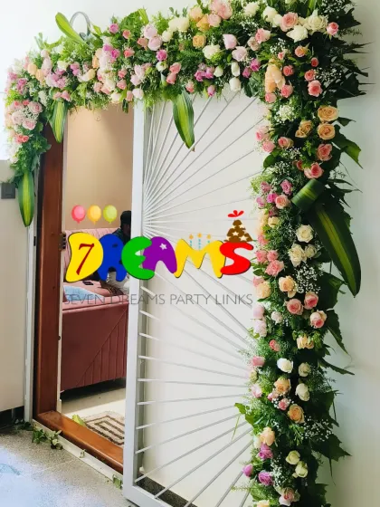 I decorated this doorway for a Gruha Pravesha ceremony. The arch is made with fresh pastel roses and local greens to create a beautiful and welcoming entrance for the new home.