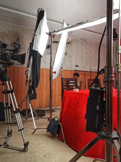 A wider view of the set, showing the lighting and camera arrangement. A lot of preparation goes into making sure every shot is perfectly lit and framed.