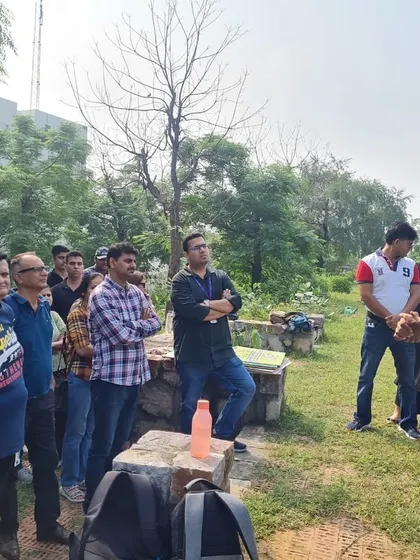 Our rewilding expert briefs the NatWest team at Ghata Bundh, explaining how their work will help combat urban flooding and recharge groundwater.