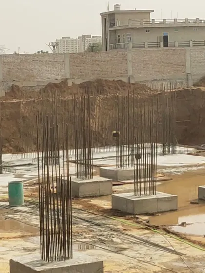 A closer view of the column footings at the AWE India School construction site. This stage establishes the structural grid that will support the entire building.