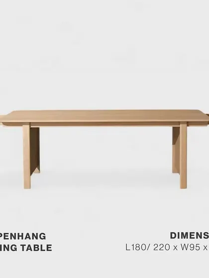 The Copenhang Dining Table, shown with its extension leaves. This versatile piece, made from solid oak and oak veneer, includes a hidden drawer, seamlessly blending sophisticated design with practical storage.
