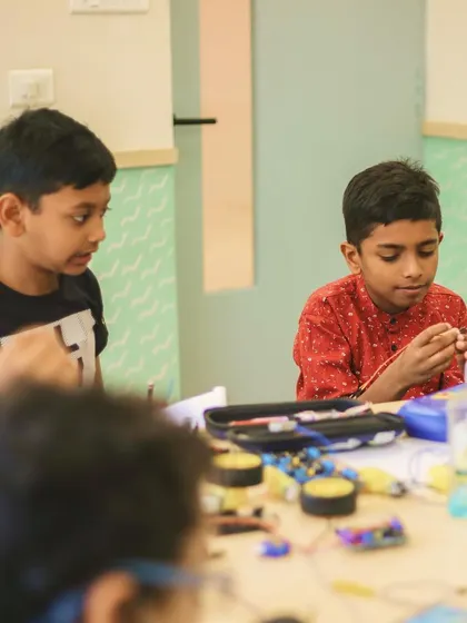 Another shot of Aethen and his friend working together, demonstrating the collaborative spirit we encourage in our robotics and STEM programs.