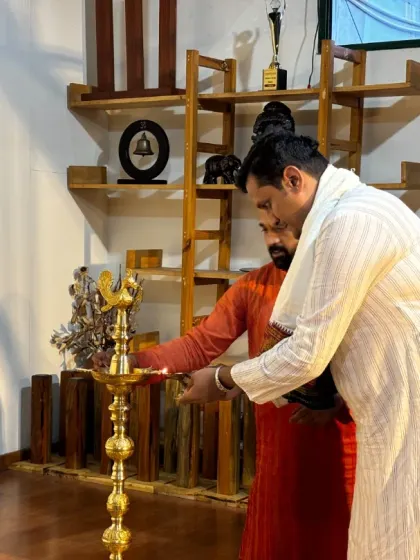 The ceremonial lighting of the lamp to inaugurate a Yoga Vichara session, symbolizing the sharing of knowledge.