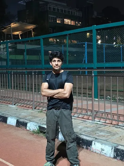 A shot from a night training session on a running track. The work doesn't stop when the sun goes down.