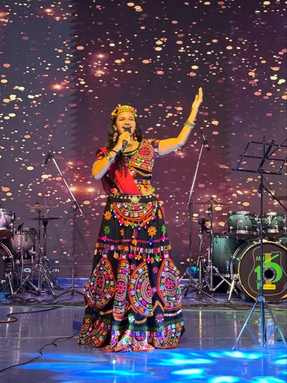 Hosting a Navratri festival is all about channeling divine energy. On stage, I combine my performance with the vibrant traditions of Garba, ensuring the entire crowd feels the festive spirit.