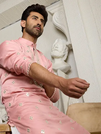 The striking pink ethnic kurta, a piece designed to be a standout reflection of your personal style and confidence.