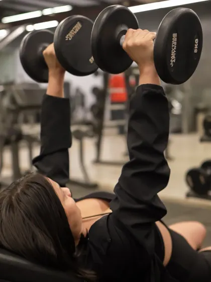 This is the focus and determination I help my clients find. A powerful dumbbell chest press like this is a milestone in strength training, built rep by rep.