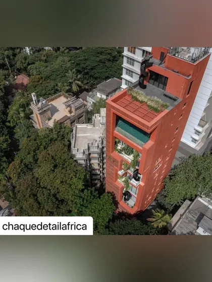 A high-angle aerial shot showing the green roof and pool area, demonstrating our ability to maximize usable green space even on the top of a high-rise building.