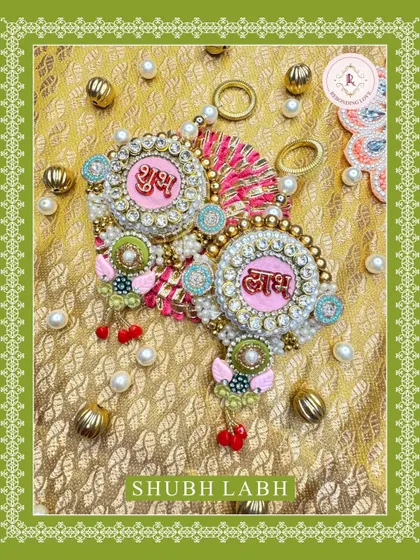 Another angle of our pink Shubh Laabh hangings, showcasing the detailed craftsmanship and the beautiful combination of colors and materials.