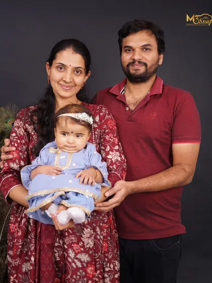 A wonderful family portrait where everyone is looking at the camera. It’s a beautiful, classic shot that is perfect for framing and displaying in the home.