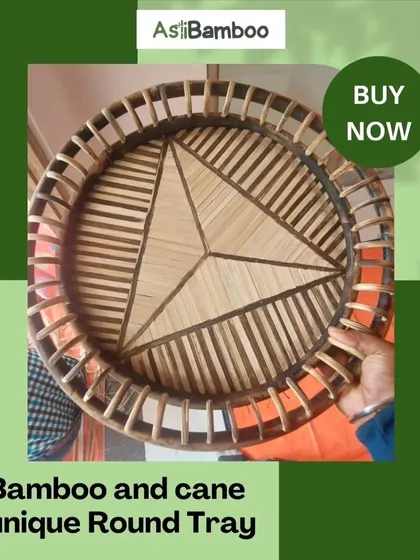 This exquisite round tray is handcrafted from bamboo and cane, featuring a unique geometric pattern at its center. It's a perfect statement piece for serving guests or as a decorative accent, blending elegance and sustainability.