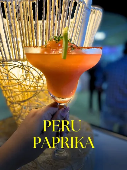 My Peru-Paprika mocktail is a slushy blend of sweet guava and spicy paprika, served in a chili-rimmed glass. It's a fiery and refreshing drink that always impresses.