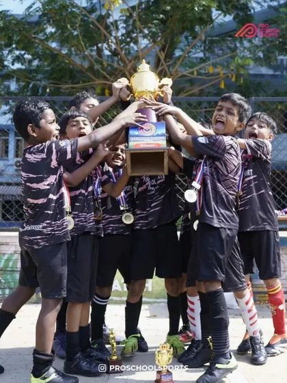 The pure, chaotic joy of victory. A throwback to our young champions celebrating their hard-earned trophy.