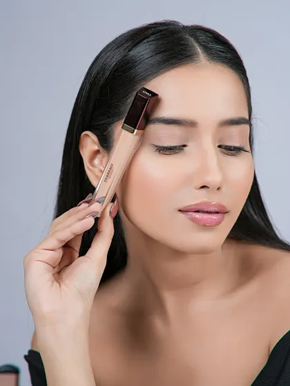Another pose from the concealer shoot, with the model's eyes closed to draw attention to the smooth under-eye area.