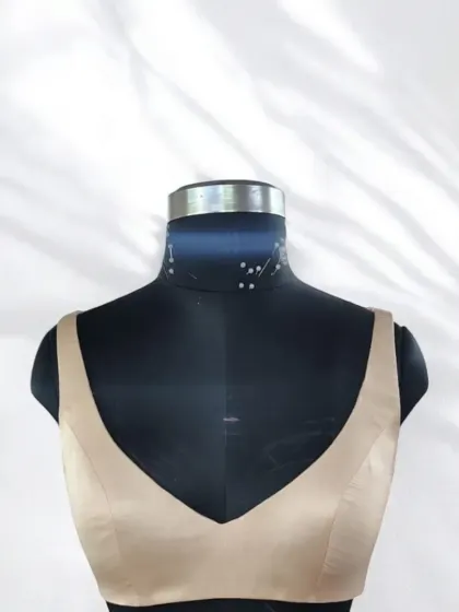 Custom fits create endless charm. This designer bustier in a neutral beige satin can turn any outfit into a statement, offering an elegant and trendy foundation for your look.