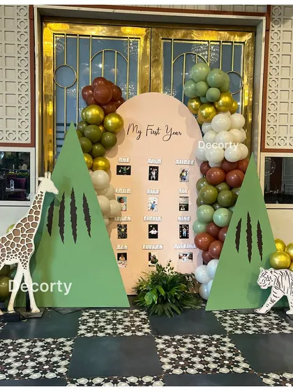 Another view of the jungle-themed 'My First Year' photo display.