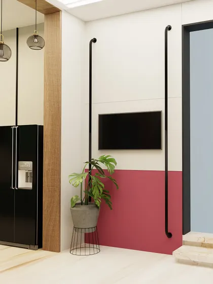 Here is another angle of the living space, showing how I use color blocking and clean lines to define different zones. The simple, wall-mounted TV is framed by minimalist black poles, creating a modern aesthetic that is both structured and warm.