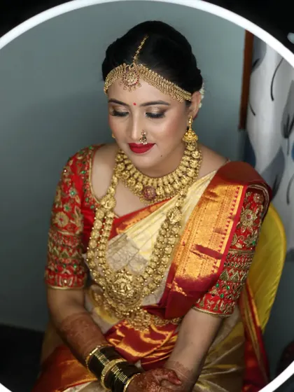 Another beautiful shot of the bride, showing the complete traditional look with the maang tikka and nose ring.