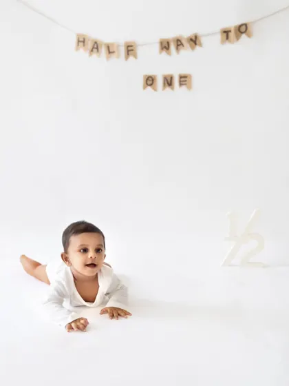 An alert and curious baby boy during his half-birthday shoot. I love capturing their expressions as they explore the studio environment.