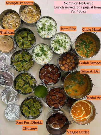 This was a special 'No Onion No Garlic' lunch for a puja at home for 40 people. The menu was packed with flavor, featuring dishes like Chole Masala, Kadhai Veg, and Moongdal ka Sheera.