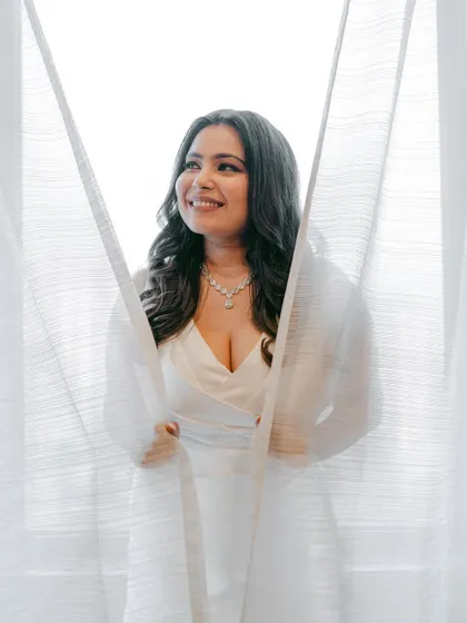 A dreamy and romantic portrait. The bride looks like she's floating, and her makeup is ethereal and glowing.