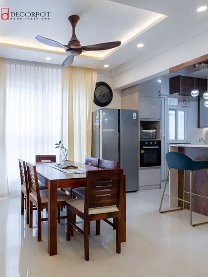 An open-plan dining and kitchen area, perfect for modern living. The design ensures a seamless flow between the two spaces, making it ideal for hosting dinners and family gatherings.
