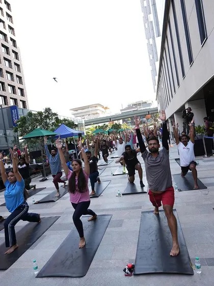 More participants holding the lunge pose, showing their strength and commitment.