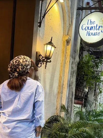 Posing outside The Country House cafe. My collaborations often include shots that highlight the exterior and signage, making the location easily recognizable for potential visitors.