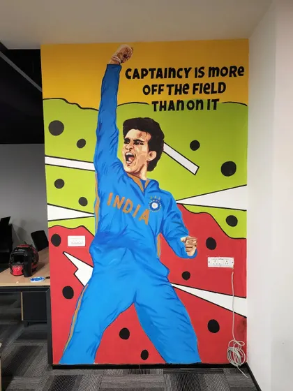 A full-sized mural of Sourav Ganguly with the quote "Captaincy is more off the field than on it."