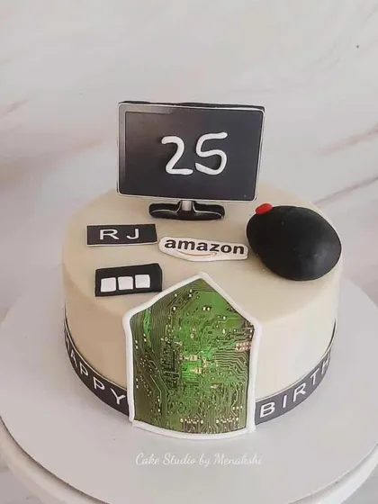 A cake for a software programmer at Amazon. This design features a computer, mouse, and an edible circuit board.