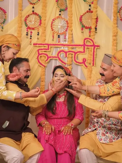 A traditional Haldi moment with the entire family participating in the ritual.