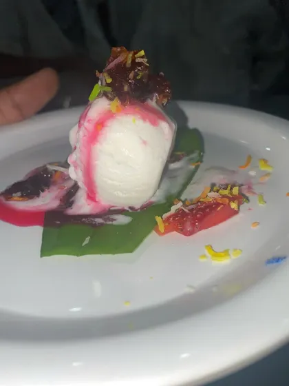 My signature Paan Vanilla Ice Cream. A scoop of vanilla ice cream served on a fresh betel leaf with gulkand and colorful sprinkles.