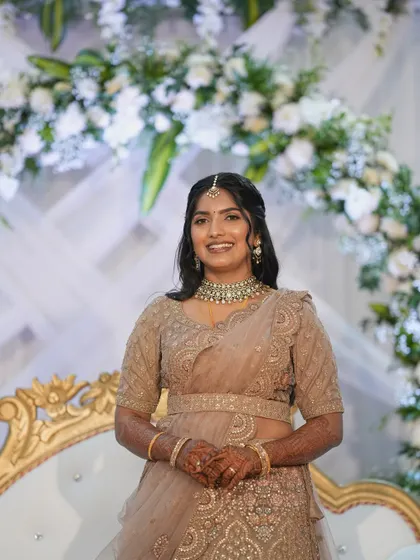 A beautiful portrait of the bride at her reception. The makeup is flawless, and the soft waves in her hair complete this romantic look.