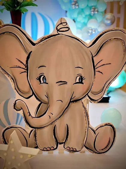 Another adorable winking elephant cutout, perfect for adding personality to a cake table or photo corner.