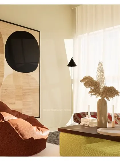 Inspired by the Japanese concept of 'Yutori', this living room design embraces simplicity and tranquility. The coffee-colored walls create a soothing ambiance, while the informal seating and abstract art encourage a relaxed, uncluttered way of life.