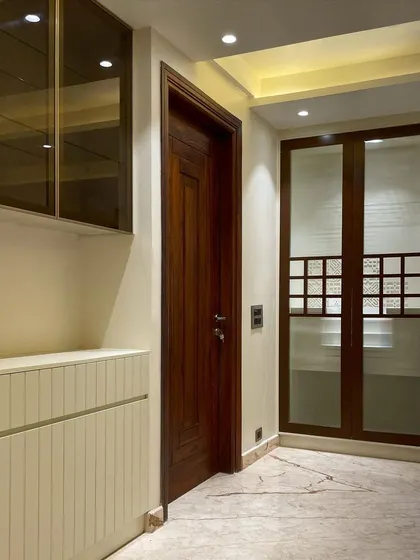 This view shows the mandir and an adjacent crockery unit, demonstrating how we integrate different functional elements into a cohesive design using a consistent material and color palette.