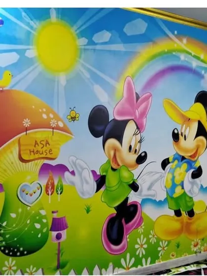 A full view of the custom Mickey and Minnie Mouse wallpaper after installation. It completely transforms the room into a happy space for children to play and grow.