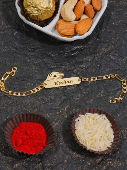 This chain rakhi is personalized with a name and a feather charm.