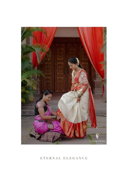 A playful moment during the wedding, with a bridesmaid helping the bride with her footwear.