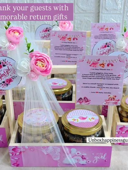 A wide view of my pink-themed baby girl announcement favors, showing how I can prepare large, coordinated orders for your special event.
