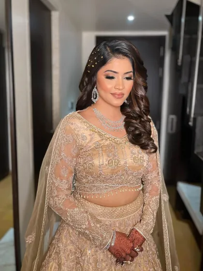 Krisha rocking her golden sangeet look. I created a classic soft glam eye with nude lips to let her intricate outfit and diamond jewelry shine.