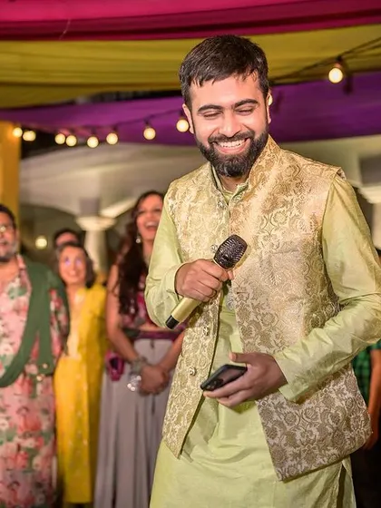 The groom's heartfelt speech during the evening celebrations, a moment of smiles and emotion.