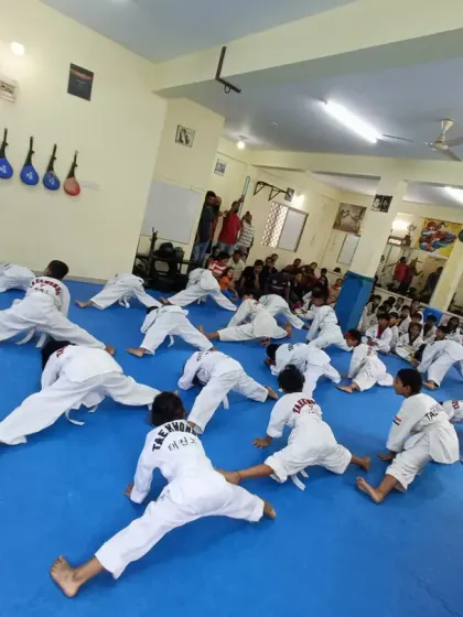 I supervise the class during their stretching routine.