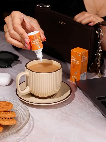 This lifestyle photo shows Sprig's Chai Masala Extract in a natural, everyday work setting. My goal here is to place the product directly into the customer's life, making it feel both aspirational and essential for their daily routine.