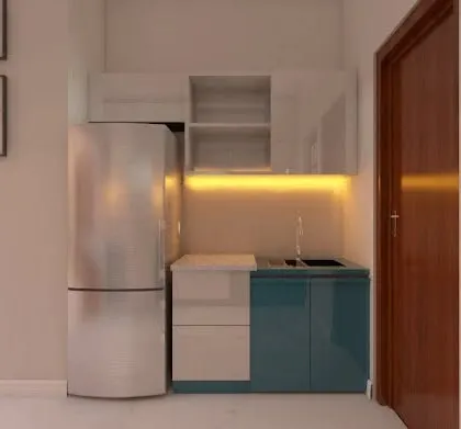 This compact kitchenette features a clever layout with teal and white cabinets. The design ensures that even in a small space, all essential functions of a kitchen are accommodated efficiently.