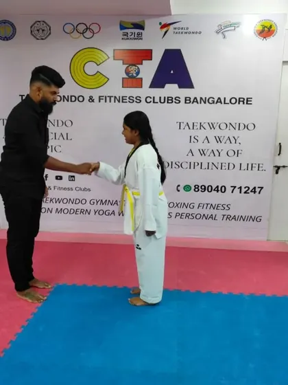 A handshake for a new yellow belt.