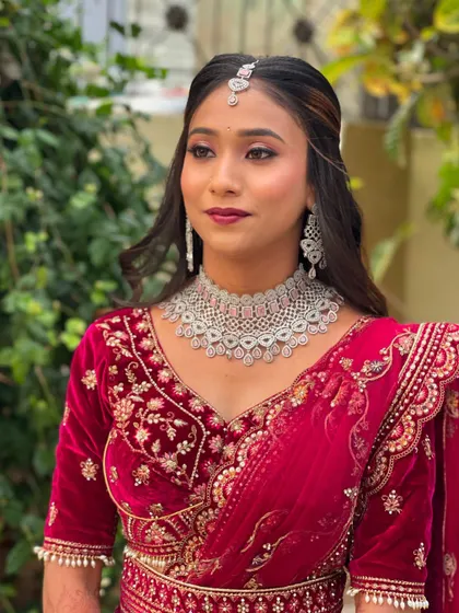 A close-up of Pallavi's reception makeup. The soft, shimmery eye makeup and perfectly matched lip color enhance her bridal glow.
