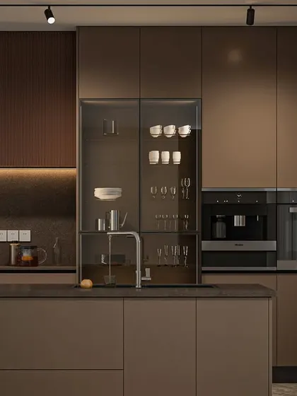 My Seamless Series is all about creating a kitchen that feels like poetry in motion. This design features handleless cabinets in earthy tones, a glass-fronted crockery unit, and fully integrated appliances. It’s a perfect example of how I blend minimalist aesthetics with high functionality for a truly premium experience.